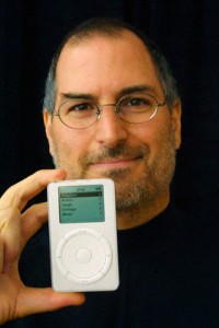 Original caption: Apple Computer CEO Steve Jobs holds up the new Apple release in Cupertino, California October 23, 2001. The new MP3 iPod music player packs up to 1,000 CD-quality songs into an ultra-portable, 6.5 ounce design that fits in your pocket. REUTERS/Susan Ragan October 23, 2001 Cupertino, California, USA